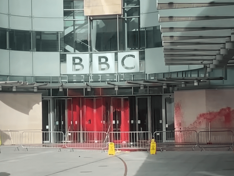 A picture of the BBC building soaked in red paint ME Awareness Day
